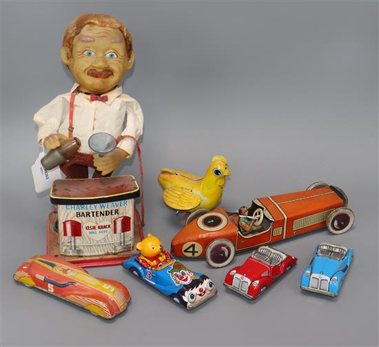 A Chad Valley tinplate racing car and a collection of other tinplate clockwork models,